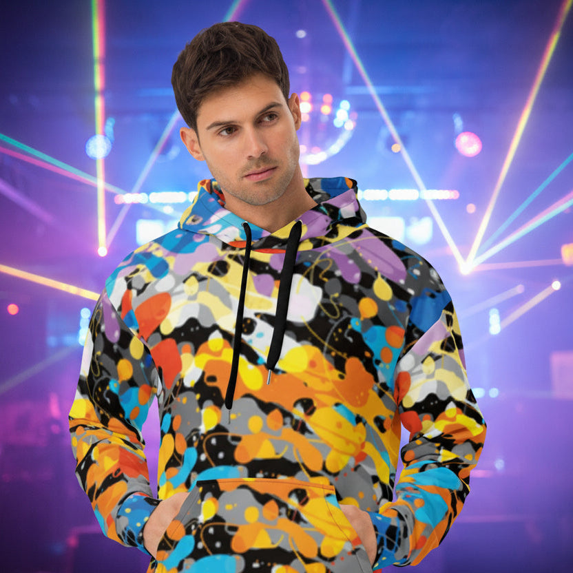 A man wearing a multicolored hoodie with a paint splatter design, featuring a double-lined hood, brushed fleece fabric inside, and drawstrings.